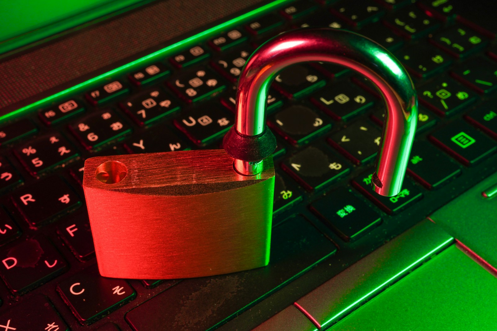 red padlock on black computer keyboard symbolizing cyber liability insurance